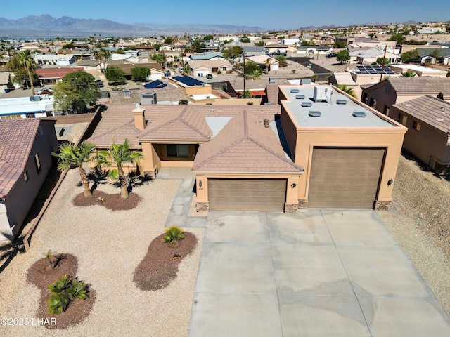 birds eye view of property featuring a residential view and a mountain view