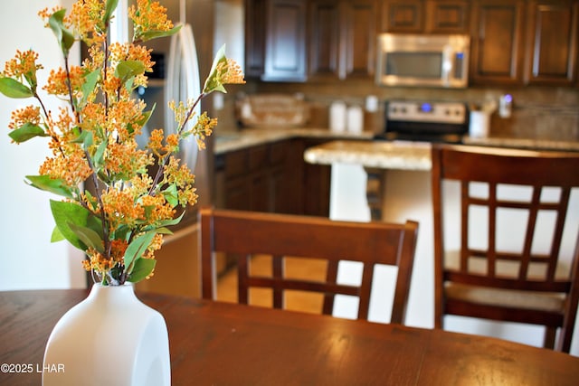 kitchen featuring electric stove and stainless steel microwave