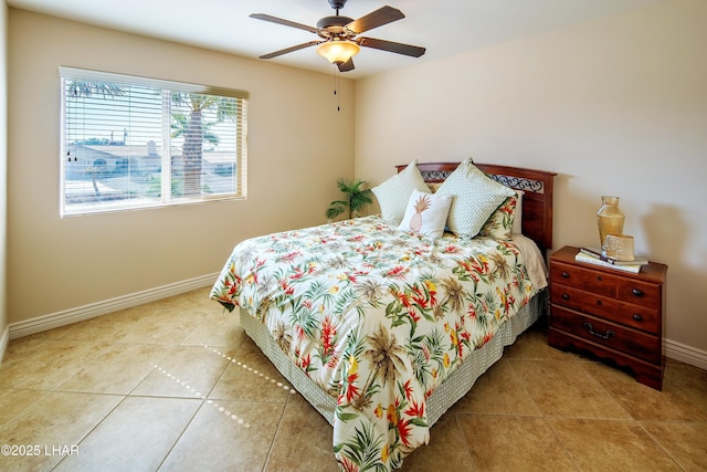 bedroom featuring ceiling fan, baseboards, and tile patterned floors