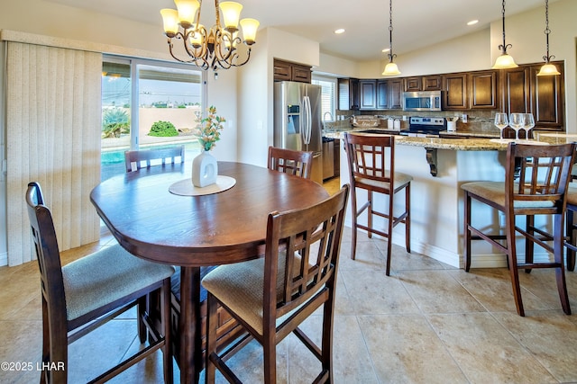 dining area with light tile patterned floors, vaulted ceiling, an inviting chandelier, and recessed lighting