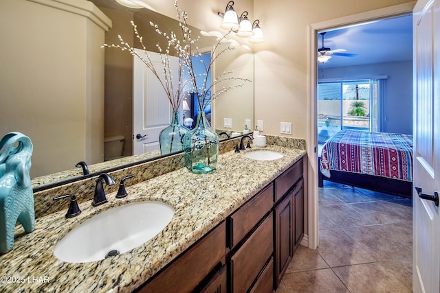 bathroom with double vanity, tile patterned flooring, ensuite bath, and a sink