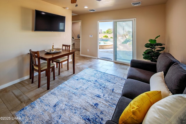 living area with a ceiling fan, recessed lighting, visible vents, and baseboards