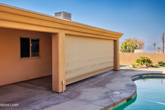 garage with fence