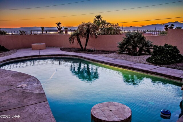 view of swimming pool featuring a fenced in pool, a patio area, and a fenced backyard