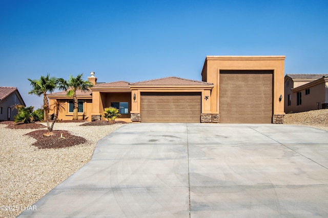 view of front of home with a garage, stone siding, driveway, and stucco siding