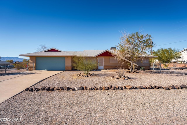 single story home with a garage and a mountain view