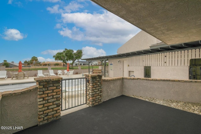 view of patio / terrace featuring fence