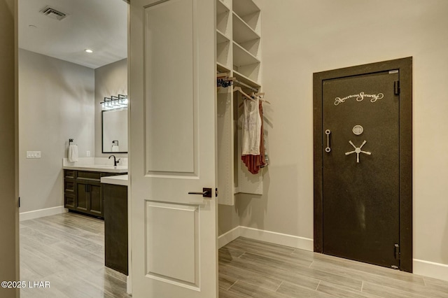 interior space featuring hardwood / wood-style flooring and vanity