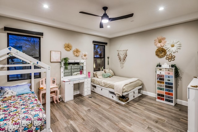 bedroom with wood-type flooring and ceiling fan