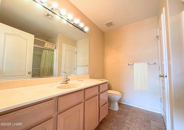 full bath with visible vents, toilet, vanity, and walk in shower