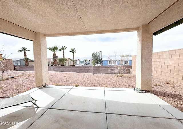 view of patio / terrace with a residential view and a fenced backyard