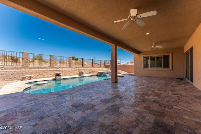 view of pool featuring an in ground hot tub, ceiling fan, and a patio