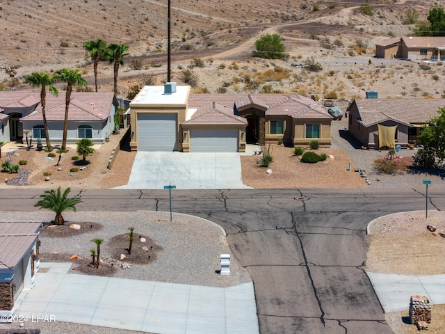 ranch-style house featuring a garage