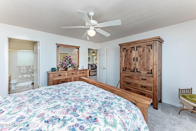 carpeted bedroom with connected bathroom, ceiling fan, and a textured ceiling