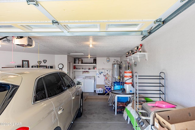 garage with a garage door opener, washing machine and dryer, and water heater