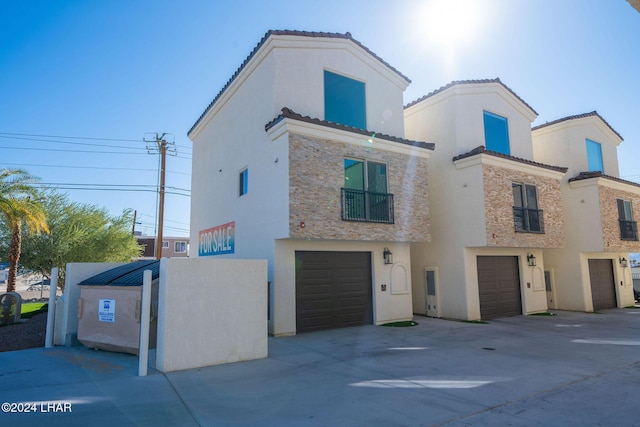 view of front of property with a garage