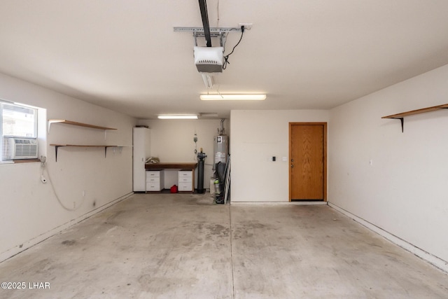 2130 Smoketree Ave N, Lake Havasu City, AZ 86403 - garage featuring a garage door opener and gas water heater