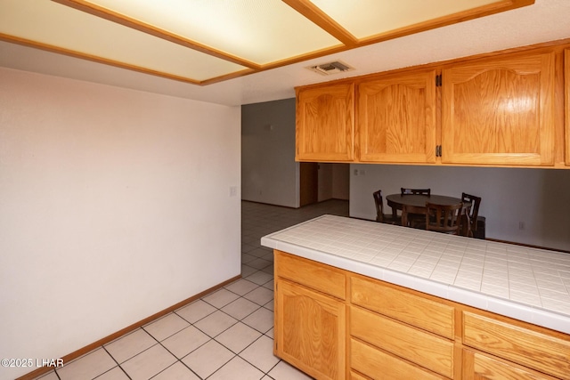 2130 Smoketree Ave N, Lake Havasu City, AZ 86403 - kitchen featuring tile countertops, visible vents, baseboards, and light tile patterned floors