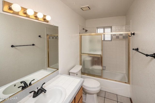 2130 Smoketree Ave N, Lake Havasu City, AZ 86403 - bathroom with toilet, tile patterned flooring, vanity, and enclosed tub / shower combo