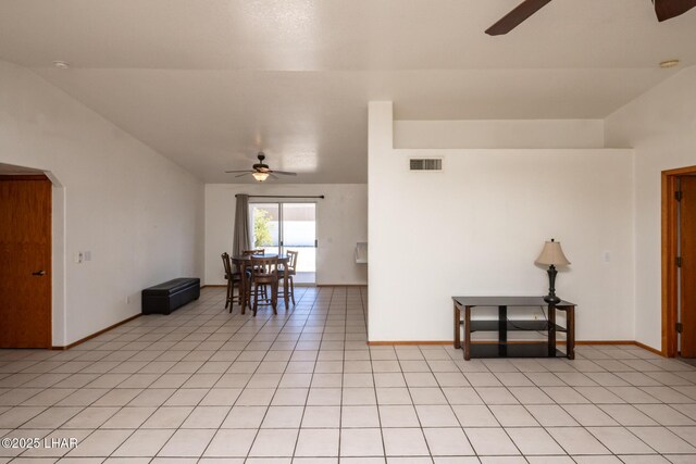 2130 Smoketree Ave N, Lake Havasu City, AZ 86403 - spare room with visible vents, vaulted ceiling, light tile patterned flooring, and ceiling fan