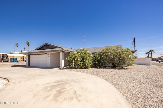 2130 Smoketree Ave N, Lake Havasu City, AZ 86403 - ranch-style home with stucco siding, driveway, a garage, and fence