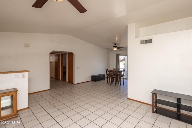 2130 Smoketree Ave N, Lake Havasu City, AZ 86403 - unfurnished room featuring light tile patterned flooring, vaulted ceiling, visible vents, and a ceiling fan