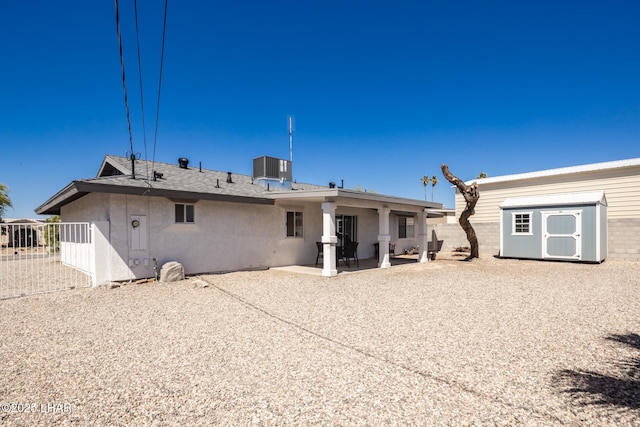 2130 Smoketree Ave N, Lake Havasu City, AZ 86403 - rear view of house featuring an outdoor structure, stucco siding, fence, a patio, and a storage shed
