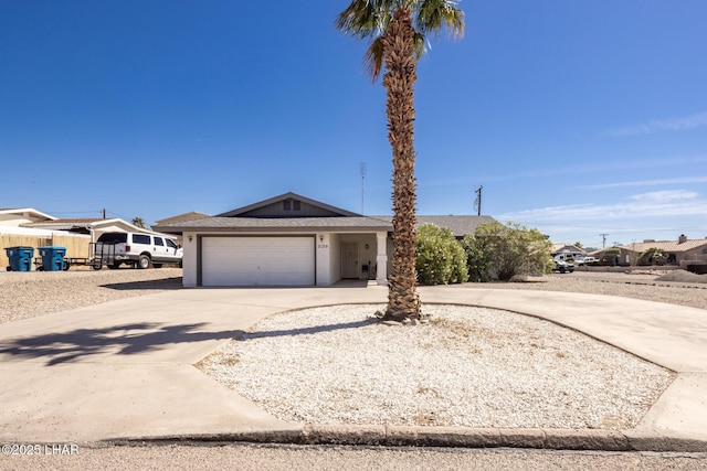 2130 Smoketree Ave N, Lake Havasu City, AZ 86403 - view of front of home with driveway and an attached garage