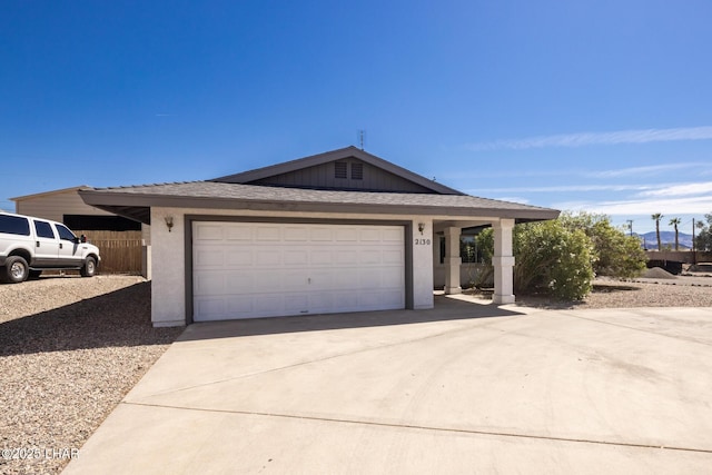 2130 Smoketree Ave N, Lake Havasu City, AZ 86403 - ranch-style house with driveway, an attached garage, roof with shingles, and stucco siding