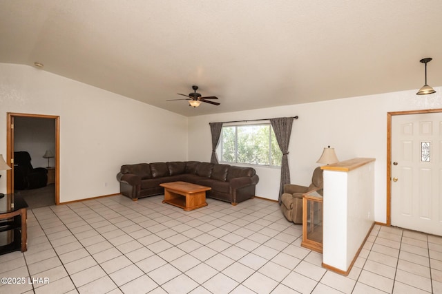 2130 Smoketree Ave N, Lake Havasu City, AZ 86403 - living room featuring baseboards, lofted ceiling, a ceiling fan, and light tile patterned floors