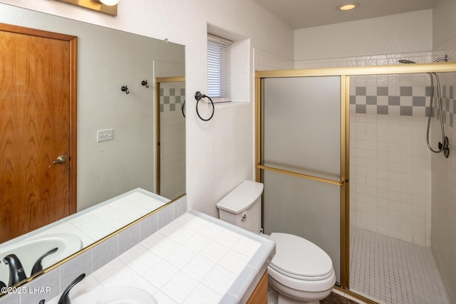 2130 Smoketree Ave N, Lake Havasu City, AZ 86403 - bathroom featuring toilet, a stall shower, and vanity