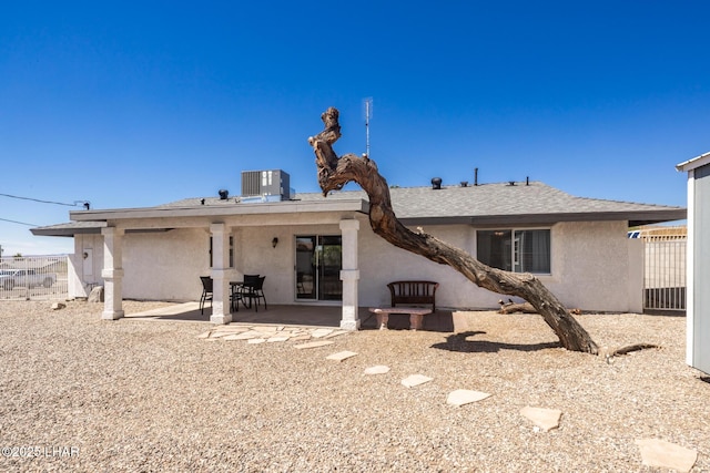 2130 Smoketree Ave N, Lake Havasu City, AZ 86403 - back of house with stucco siding, central air condition unit, a patio, and fence