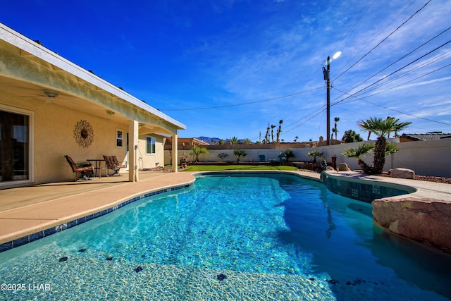 view of swimming pool featuring a patio area, a fenced backyard, and a fenced in pool