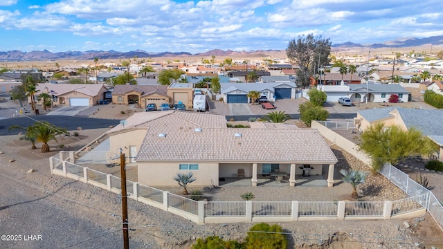 birds eye view of property with a residential view and a mountain view