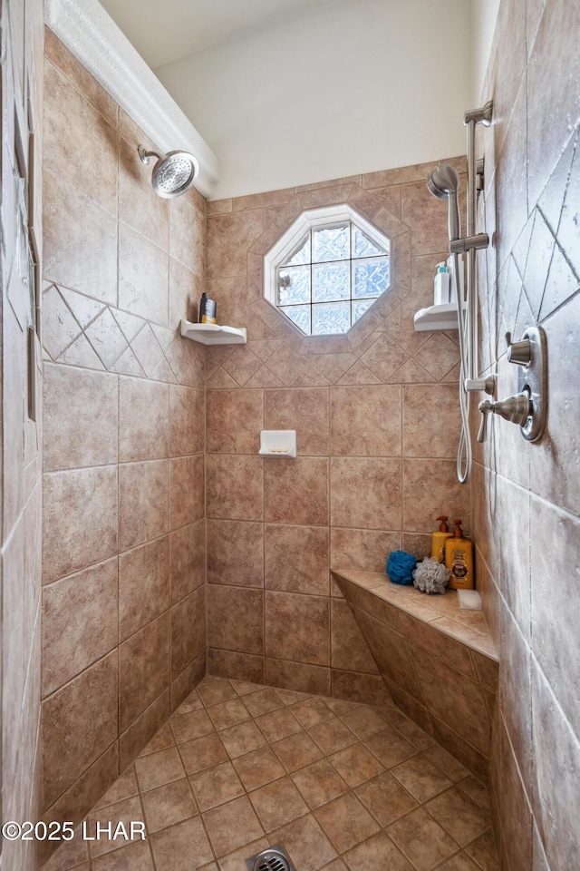 full bath featuring tiled shower