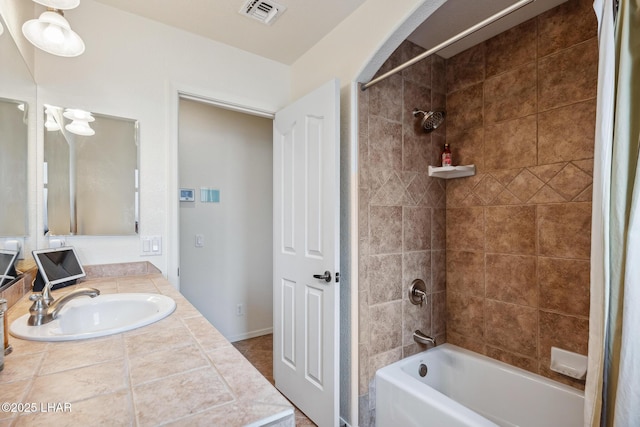 full bathroom featuring vanity, visible vents, and shower / bathing tub combination