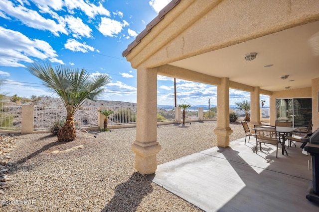 view of patio / terrace featuring fence private yard and outdoor dining area