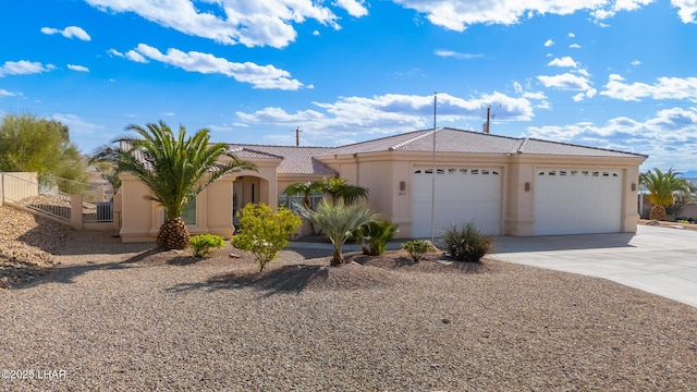 view of front facade featuring a garage, fence, a tile roof, driveway, and stucco siding