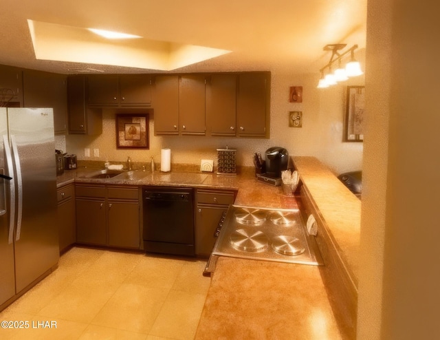 kitchen with a sink, range, dishwasher, and stainless steel refrigerator with ice dispenser