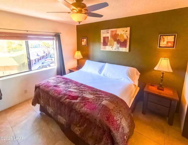 bedroom featuring tile patterned flooring and ceiling fan