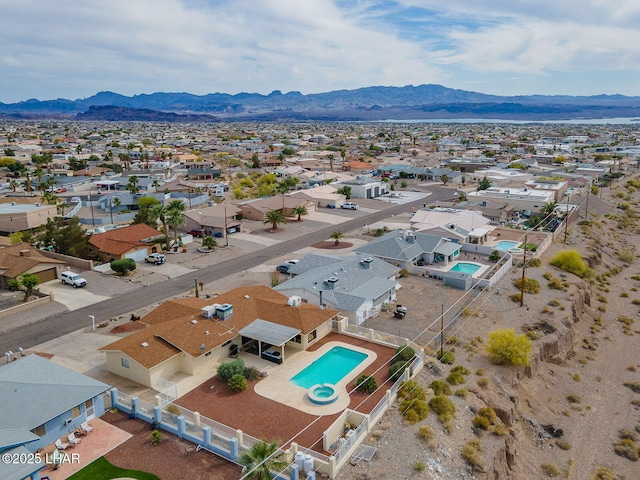 drone / aerial view featuring a residential view and a mountain view
