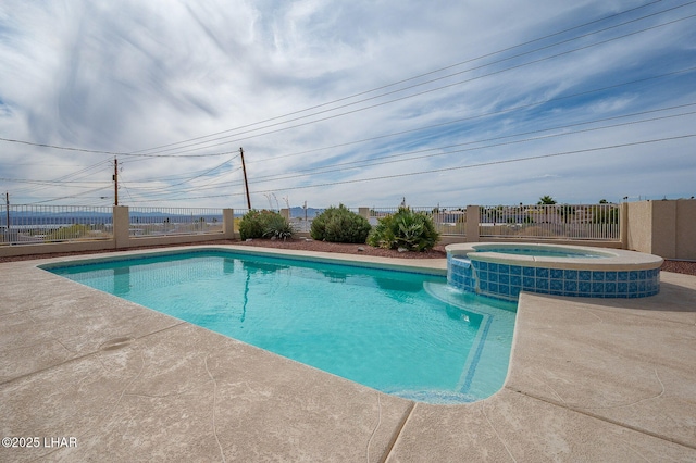 view of swimming pool with fence and a pool with connected hot tub