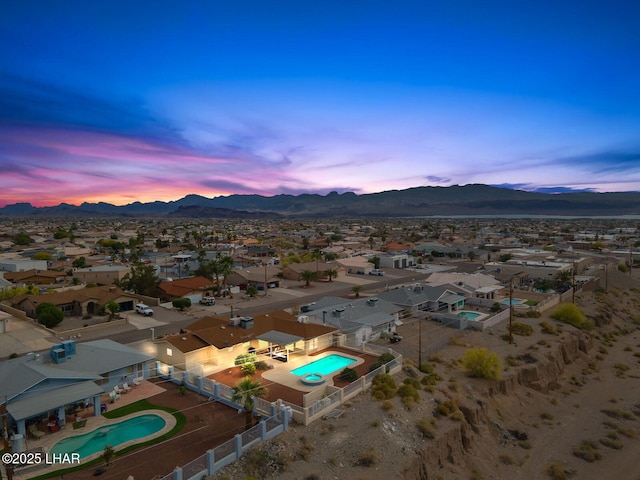 aerial view at dusk with a residential view and a mountain view