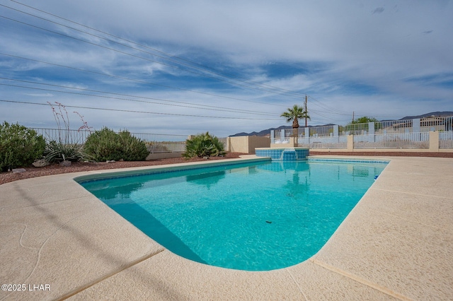 view of pool with a fenced in pool and fence