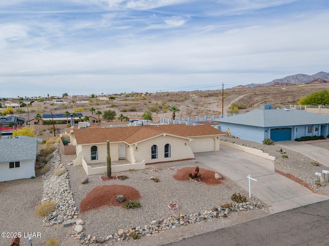 birds eye view of property with a mountain view