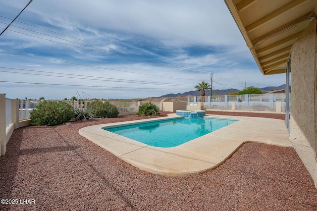 view of pool with a patio, a pool with connected hot tub, and a fenced backyard