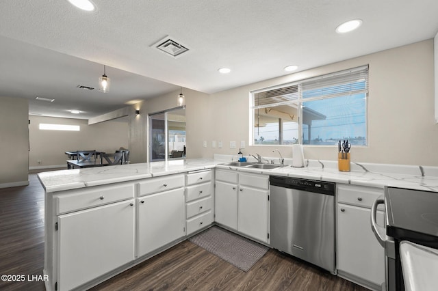 kitchen featuring stainless steel dishwasher, a peninsula, electric range, and visible vents