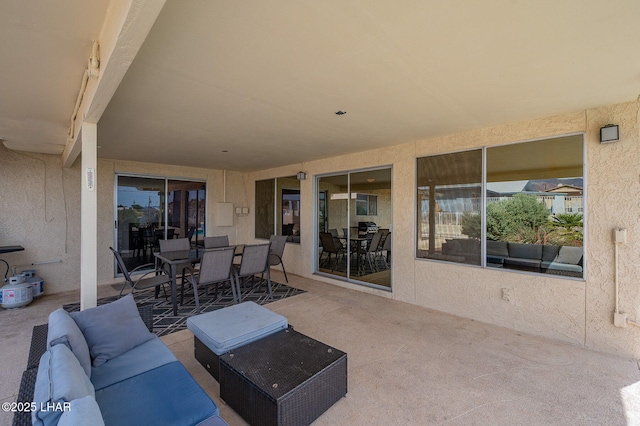 view of patio featuring an outdoor living space and outdoor dining space