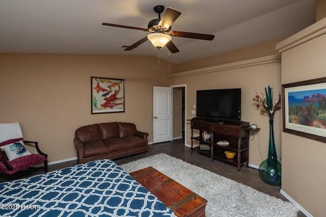 bedroom featuring a ceiling fan, baseboards, and vaulted ceiling