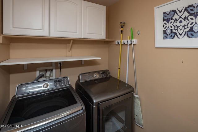 laundry room with cabinet space and independent washer and dryer